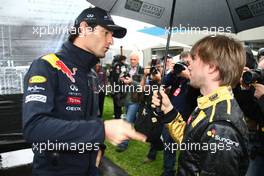 24.03.2011 Melbourne, Australia,  Mark Webber (AUS), Red Bull Racing and Nick Heidfeld (GER), Lotus Renault GP - Formula 1 World Championship, Rd 01, Australian Grand Prix, Thursday
