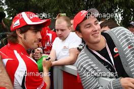 24.03.2011 Melbourne, Australia,  Fernando Alonso (ESP), Scuderia Ferrari signs an autograph - Formula 1 World Championship, Rd 01, Australian Grand Prix, Thursday