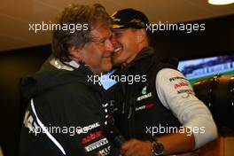 27.08.2011 Spa Francorchamps, Belgium,  Norbert Haug (GER), Mercedes, Motorsport chief with Michael Schumacher (GER), Mercedes GP Petronas F1 Team celebrates his first F1 drive at Spa 20 years ago - Formula 1 World Championship, Rd 12, Belgian Grand Prix, Saturday