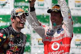 27.11.2011 Sao Paulo, Brazil, Mark Webber (AUS), Red Bull Racing and Jenson Button (GBR), McLaren Mercedes  - Formula 1 World Championship, Rd 19, Brazilian Grand Prix, Sunday Podium