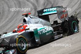 27.11.2011 Interlargos, Brazil,  Michael Schumacher (GER), Mercedes GP gets a puncture  - Formula 1 World Championship, Rd 19, Brazilian Grand Prix, Sunday Race