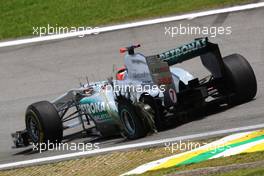 27.11.2011 Interlargos, Brazil,  Michael Schumacher (GER), Mercedes GP gets a puncture - Formula 1 World Championship, Rd 19, Brazilian Grand Prix, Sunday Race