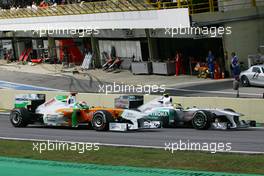 27.11.2011 Sao Paulo, Brazil, Adrian Sutil (GER), Force India F1 Team and Nico Rosberg (GER), Mercedes GP Petronas F1 Team  - Formula 1 World Championship, Rd 19, Brazilian Grand Prix, Sunday Race