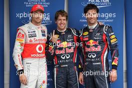 26.11.2011 Sao Paulo, Brazil, Sebastian Vettel (GER), Red Bull Racing gets pole position and with Jenson Button (GBR), McLaren Mercedes and Mark Webber (AUS), Red Bull Racing  - Formula 1 World Championship, Rd 19, Brazilian Grand Prix, Saturday Qualifying