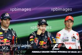 26.11.2011 Interlargos, Brazil,  Mark Webber (AUS), Red Bull Racing, Sebastian Vettel (GER), Red Bull Racing and Jenson Button (GBR), McLaren Mercedes  - Formula 1 World Championship, Rd 19, Brazilian Grand Prix, Saturday Qualifying