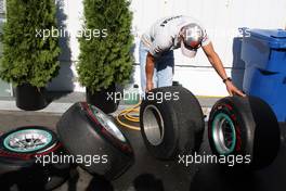 10.06.2011 Montreal, Canada,  Michael Schumacher (GER), Mercedes GP Petronas F1 Team looks at tyres - Formula 1 World Championship, Rd 07, Canadian Grand Prix, Friday