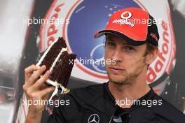 10.06.2011 Montreal, Canada,  Jenson Button (GBR), McLaren Mercedes and the 10 000 laps cake - Formula 1 World Championship, Rd 07, Canadian Grand Prix, Friday