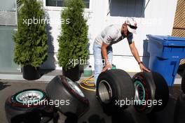 10.06.2011 Montreal, Canada,  Michael Schumacher (GER), Mercedes GP Petronas F1 Team looks at tyres - Formula 1 World Championship, Rd 07, Canadian Grand Prix, Friday