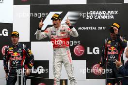 12.06.2011 Montreal, Canada,  Sebastian Vettel (GER), Red Bull Racing,  Jenson Button (GBR), McLaren Mercedes, Mark Webber (AUS), Red Bull Racing - Formula 1 World Championship, Rd 07, Canadian Grand Prix, Sunday Podium