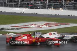 12.06.2011 Montreal, Canada,  Kamui Kobayashi (JAP), Sauber F1 Team and Felipe Massa (BRA), Scuderia Ferrari - Formula 1 World Championship, Rd 07, Canadian Grand Prix, Sunday Race