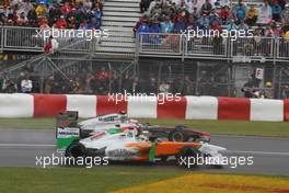 12.06.2011 Montreal, Canada,  Timo Glock (GER), Marussia Virgin Racing and Jenson Button (GBR), McLaren Mercedes - Formula 1 World Championship, Rd 07, Canadian Grand Prix, Sunday Race