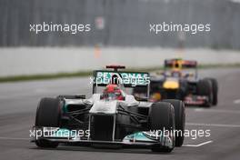 12.06.2011 Montreal, Canada,  Michael Schumacher (GER), Mercedes GP Petronas F1 Team leads Mark Webber (AUs), Red Bull Racing - Formula 1 World Championship, Rd 07, Canadian Grand Prix, Sunday Race