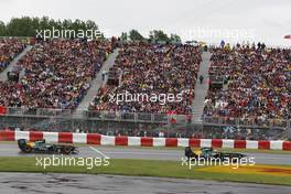 12.06.2011 Montreal, Canada,  Jarno Trulli (ITA), Team Lotus leads Heikki Kovalainen (FIN), Team Lotus - Formula 1 World Championship, Rd 07, Canadian Grand Prix, Sunday Race