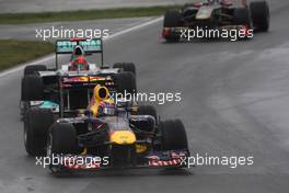 12.06.2011 Montreal, Canada,  Mark Webber (AUS), Red Bull Racing leads Michael Schumacher (GER), Mercedes GP Petronas F1 Team - Formula 1 World Championship, Rd 07, Canadian Grand Prix, Sunday Race