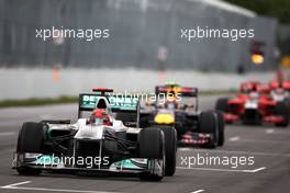 12.06.2011 Montreal, Canada,  Michael Schumacher (GER), Mercedes GP Petronas F1 Team leads Mark Webber (AUS), Red Bull Racing - Formula 1 World Championship, Rd 07, Canadian Grand Prix, Sunday Race