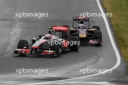 12.06.2011 Montreal, Canada, Jenson Button  (GBR) Vodafone McLaren Mercedes, Jaime Alguersuari (MEX) Scuderia Toro Rosso - Formula 1 World Championship, Rd 7, Canadian Grand Prix, Sunday Race