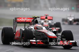 12.06.2011 Montreal, Canada,  Jenson Button (GBR), McLaren Mercedes leads Lewis Hamilton (GBR), McLaren Mercedes - Formula 1 World Championship, Rd 07, Canadian Grand Prix, Sunday Race