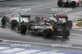 12.06.2011 Montreal, Canada, Jarno Trulli  (ITA) Team Lotus, Jenson Button  (GBR) Vodafone McLaren Mercedes, Vitantonio Liuzzi (ITA) HRT F1 Team  - Formula 1 World Championship, Rd 7, Canadian Grand Prix, Sunday Race