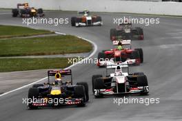 12.06.2011 Montreal, Canada,  Sebastian Vettel (GER), Red Bull Racing leads Kamui Kobayashi (JAP), Sauber F1 Team, C30 - Formula 1 World Championship, Rd 07, Canadian Grand Prix, Sunday Race
