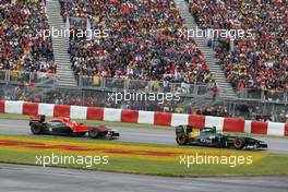 12.06.2011 Montreal, Canada,  Heikki Kovalainen (FIN), Team Lotus leads Timo Glock (GER), Marussia Virgin Racing - Formula 1 World Championship, Rd 07, Canadian Grand Prix, Sunday Race