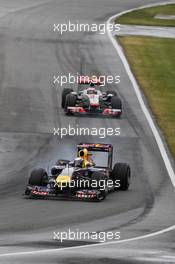 12.06.2011 Montreal, Canada, Sebastian Vettel (DEU) Red Bull Racing, Jenson Button  (GBR) Vodafone McLaren Mercedes - Formula 1 World Championship, Rd 7, Canadian Grand Prix, Sunday Race