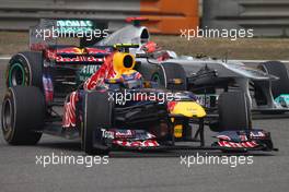 15.04.2011 Shanghai, China,  Mark Webber (AUS), Red Bull Racing and Michael Schumacher (GER), Mercedes GP  - Formula 1 World Championship, Rd 03, Chinese Grand Prix, Friday Practice