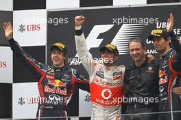 17.04.2011 Shanghai, China,  Sebastian Vettel (GER), Red Bull Racing, Lewis Hamilton (GBR), McLaren Mercedes and Mark Webber (AUS), Red Bull Racing  - Formula 1 World Championship, Rd 03, Chinese Grand Prix, Sunday Podium