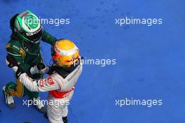 17.04.2011 Shanghai, China,  Heikki Kovalainen (FIN), Team Lotus and Lewis Hamilton (GBR), McLaren Mercedes  - Formula 1 World Championship, Rd 03, Chinese Grand Prix, Sunday Podium