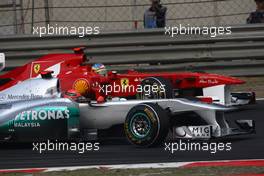 17.04.2011 Shanghai, China,  Michael Schumacher (GER), Mercedes GP and Fernando Alonso (ESP), Scuderia Ferrari  - Formula 1 World Championship, Rd 03, Chinese Grand Prix, Sunday Race