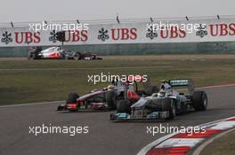 17.04.2011 Shanghai, China,  Nico Rosberg (GER), Mercedes GP and Lewis Hamilton (GBR), McLaren Mercedes  - Formula 1 World Championship, Rd 03, Chinese Grand Prix, Sunday Race