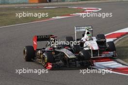 17.04.2011 Shanghai, China,  Nick Heidfeld (GER), Lotus Renault F1 Team and Sergio Perez (MEX), Sauber F1 Team  - Formula 1 World Championship, Rd 03, Chinese Grand Prix, Sunday Race