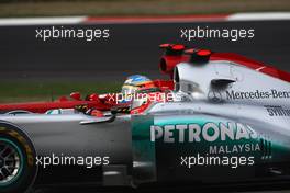 17.04.2011 Shanghai, China,  Michael Schumacher (GER), Mercedes GP and Fernando Alonso (ESP), Scuderia Ferrari  - Formula 1 World Championship, Rd 03, Chinese Grand Prix, Sunday Race