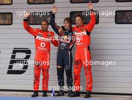 16.04.2011 Shanghai, China,  Lewis Hamilton (GBR), McLaren Mercedes, Sebastian Vettel (GER), Red Bull Racing and Jenson Button (GBR), McLaren Mercedes  - Formula 1 World Championship, Rd 03, Chinese Grand Prix, Saturday Qualifying