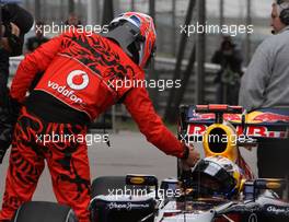 16.04.2011 Shanghai, China,  Jenson Button (GBR), McLaren Mercedes and Sebastian Vettel (GER), Red Bull Racing  - Formula 1 World Championship, Rd 03, Chinese Grand Prix, Saturday Qualifying