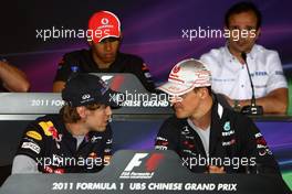 14.04.2011 Shanghai, China,  Sebastian Vettel (GER), Red Bull Racing and Michael Schumacher (GER), Mercedes GP  - Formula 1 World Championship, Rd 03, Chinese Grand Prix, Thursday