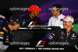 14.04.2011 Shanghai, China,  Sebastian Vettel (GER), Red Bull Racing and Michael Schumacher (GER), Mercedes GP  - Formula 1 World Championship, Rd 03, Chinese Grand Prix, Thursday