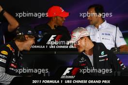 14.04.2011 Shanghai, China,  Sebastian Vettel (GER), Red Bull Racing and Michael Schumacher (GER), Mercedes GP  - Formula 1 World Championship, Rd 03, Chinese Grand Prix, Thursday