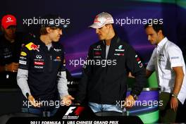 14.04.2011 Shanghai, China,  Sebastian Vettel (GER), Red Bull Racing and Michael Schumacher (GER), Mercedes GP  - Formula 1 World Championship, Rd 03, Chinese Grand Prix, Thursday