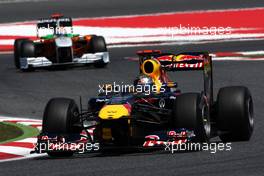 20.05.2011 Barcelona, Spain,  Sebastian Vettel (GER), Red Bull Racing, RB7 leads Adrian Sutil (GER), Force India F1 Team, VJM-04 - Formula 1 World Championship, Rd 05, Spainish Grand Prix, Friday Practice