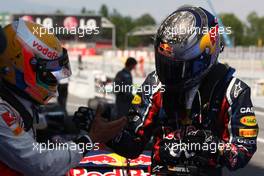 22.05.2011 Barcelona, Spain,  Sebastian Vettel (GER), Red Bull Racing, celebrates victory in parc ferme with Lewis Hamilton (GBR), McLaren Mercedes  - Formula 1 World Championship, Rd 05, Spainish Grand Prix, Sunday Podium