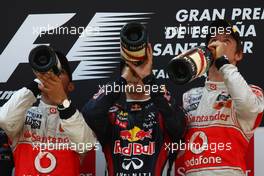 22.05.2011 Barcelona, Spain,  Lewis Hamilton (GBR), McLaren Mercedes with 1st place race winner Sebastian Vettel (GER), Red Bull Racing and 3rd place Jenson Button (GBR), McLaren Mercedes - Formula 1 World Championship, Rd 05, Spainish Grand Prix, Sunday Podium