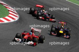 22.05.2011 Barcelona, Spain,  Fernando Alonso (ESP), Scuderia Ferrari leads Sebastian Vettel (GER), Red Bull Racing and Lewis Hamilton (GBR), McLaren Mercedes, MP4-26 - Formula 1 World Championship, Rd 05, Spainish Grand Prix, Sunday Race