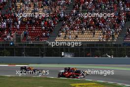 22.05.2011 Barcelona, Spain,  Fernando Alonso (ESP), Scuderia Ferrari, F150 and Sebastian Vettel (GER), Red Bull Racing, RB7 lead at the start - Formula 1 World Championship, Rd 05, Spainish Grand Prix, Sunday Race