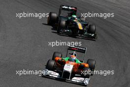 22.05.2011 Barcelona, Spain,  Adrian Sutil (GER), Force India F1 Team, VJM-04 leads Heikki Kovalainen (FIN), Team Lotus, TL11 - Formula 1 World Championship, Rd 05, Spainish Grand Prix, Sunday Race