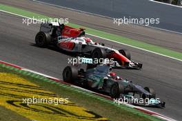 22.05.2011 Barcelona, Spain,  Michael Schumacher (GER), Mercedes GP Petronas F1 Team leads Narain Karthikeyan (IND), Hispania Racing F1 Team, HRT - Formula 1 World Championship, Rd 05, Spainish Grand Prix, Sunday Race