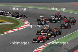 22.05.2011 Barcelona, Spain,  Fernando Alonso (ESP), Scuderia Ferrari, F150 leads at the start - Formula 1 World Championship, Rd 05, Spainish Grand Prix, Sunday Race