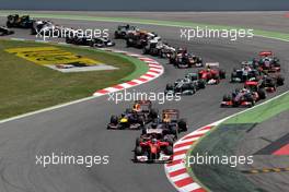 22.05.2011 Barcelona, Spain,  Fernando Alonso (ESP), Scuderia Ferrari, F150 leads at the start - Formula 1 World Championship, Rd 05, Spainish Grand Prix, Sunday Race