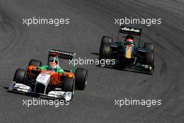 22.05.2011 Barcelona, Spain,  Adrian Sutil (GER), Force India F1 Team leads Jarno Trulli (ITA), Team Lotus - Formula 1 World Championship, Rd 05, Spainish Grand Prix, Sunday Race