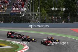 22.05.2011 Barcelona, Spain,  Fernando Alonso (ESP), Scuderia Ferrari, F150 leads at the start - Formula 1 World Championship, Rd 05, Spainish Grand Prix, Sunday Race