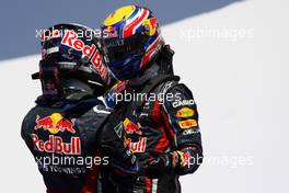 26.06.2011 Valencia, Spain,  Sebastian Vettel (GER), Red Bull Racing, celebrates his win in parc ferme with Mark Webber (AUS), Red Bull Racing  - Formula 1 World Championship, Rd 08, European Grand Prix, Sunday Podium